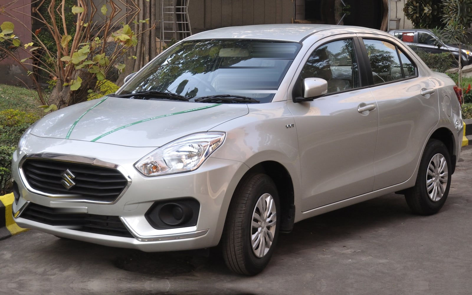 Silver Maruti Suzuki Dzire sedan